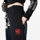 Close up of black hoodie, showing texture of the cotton fabric