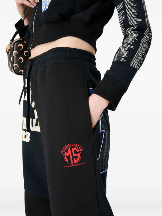 Close up of black hoodie, showing texture of the cotton fabric