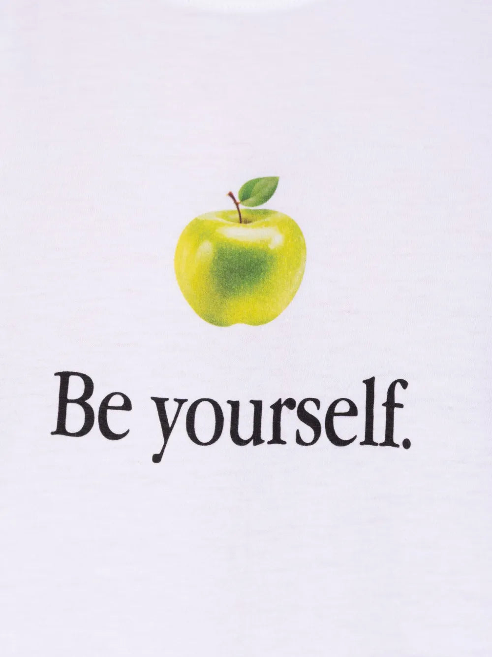 Close up of the white t-shirt, showing texture of the cotton fabric