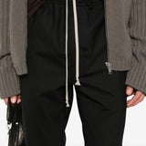 Close up of black pants, showing texture of the  cotton fabric