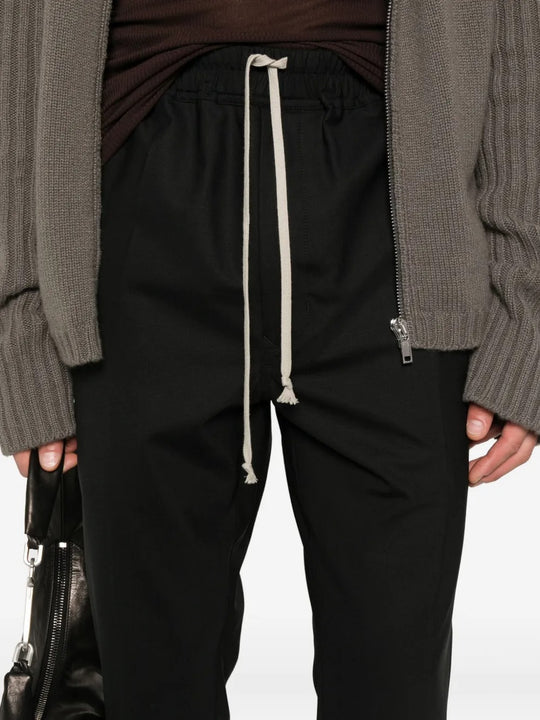 Close up of black pants, showing texture of the  cotton fabric