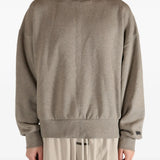 Brown top worn by a person, showing the top's fit