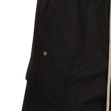 Close up of the black pant, showing texture of the cotton fabric