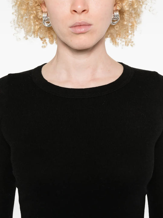 Close up of black shirt, showing texture of the fabric