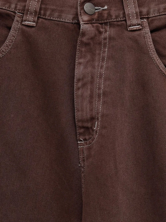 Close up of brown pant,showing texture of the cotton fabric.