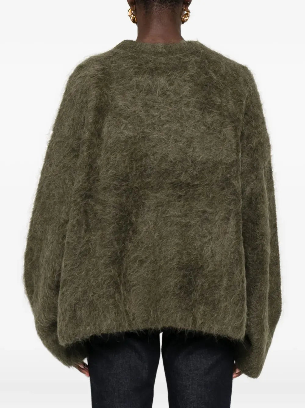 Brown knitwear worn by a person, showing the knitwear fit