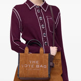 Brown bag worn by a person, showing the bag's fit