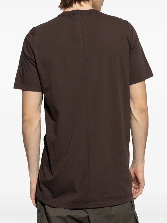 Brown t-shirt worn by a person, showing the shirt's fit