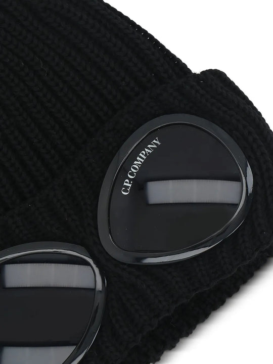 Close up of the black beanie, showing texture of the wool fabric