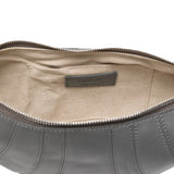Close up of the grey bag, showing texture of the leather fabric
