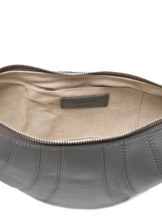 Close up of the grey bag, showing texture of the leather fabric