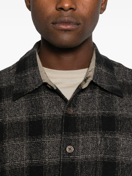 Close up of grey shirt, showing texture of the cotton fabric