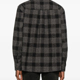 Grey shirt worn by a person, showing the shirt's fit