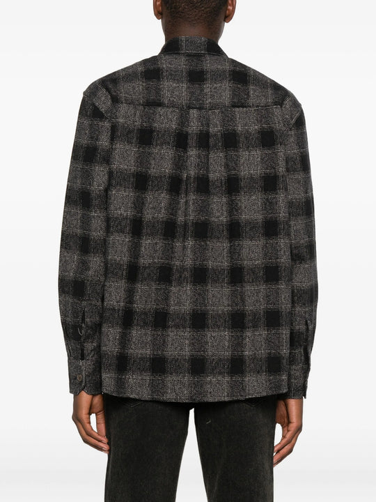 Grey shirt worn by a person, showing the shirt's fit