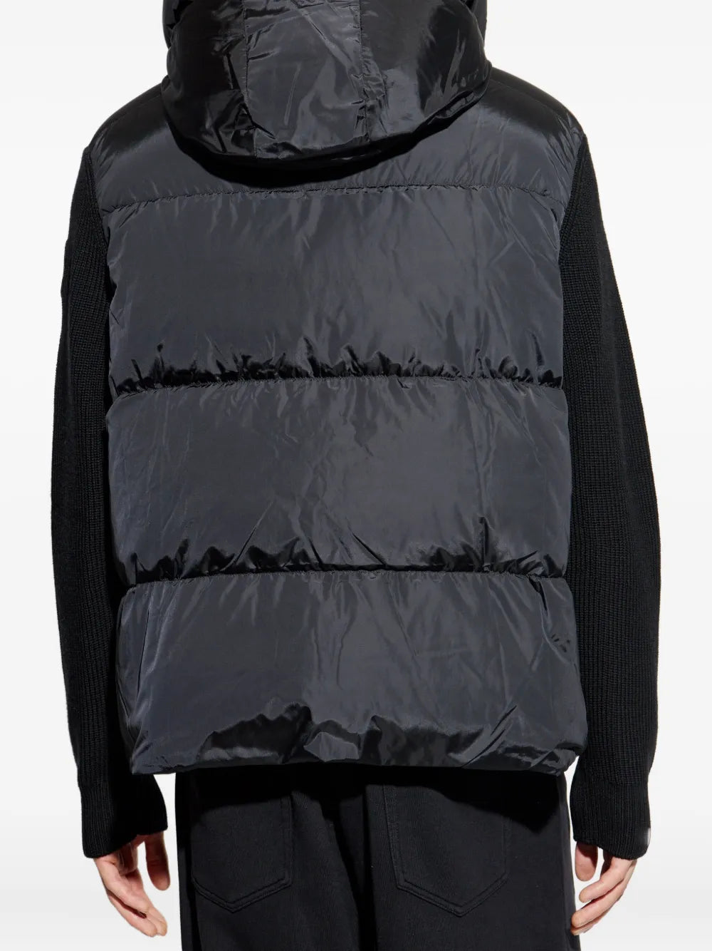 Black hoodie worn by a person, showing the hoodie's fit