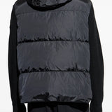 Black hoodie worn by a person, showing the hoodie's fit