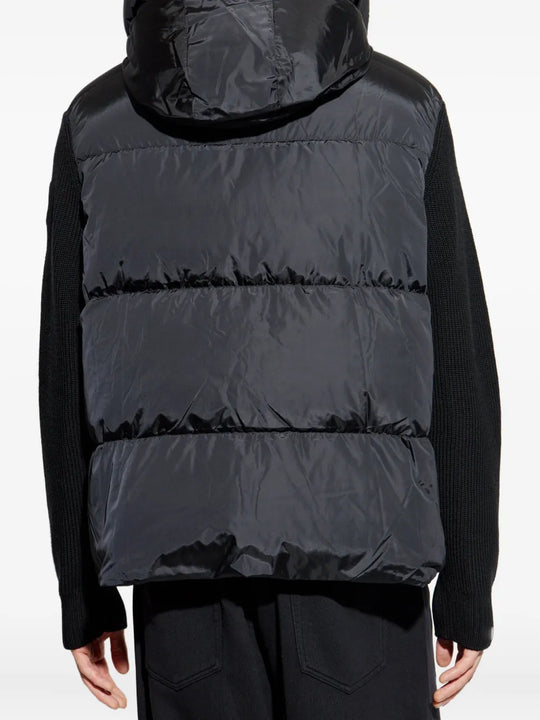Black hoodie worn by a person, showing the hoodie's fit