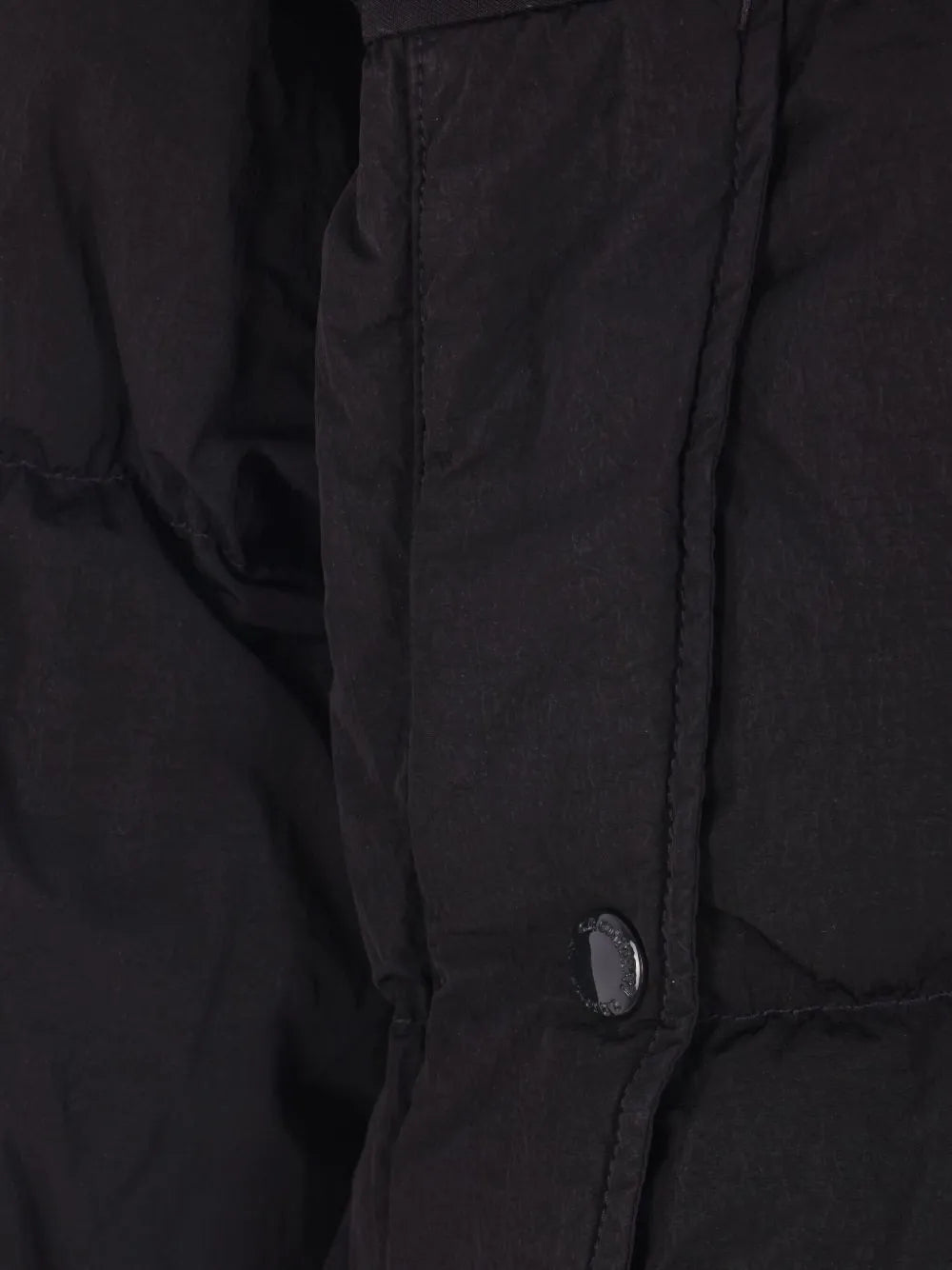 Close up of the black jacket, showing texture of the polyamide fabric