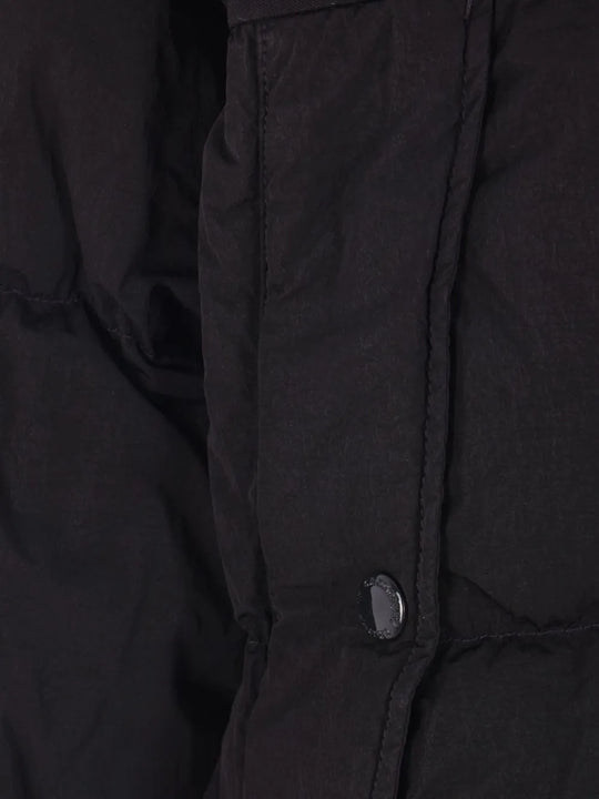 Close up of the black jacket, showing texture of the polyamide fabric