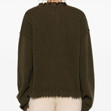 Green top worn by a person, showing the top fit