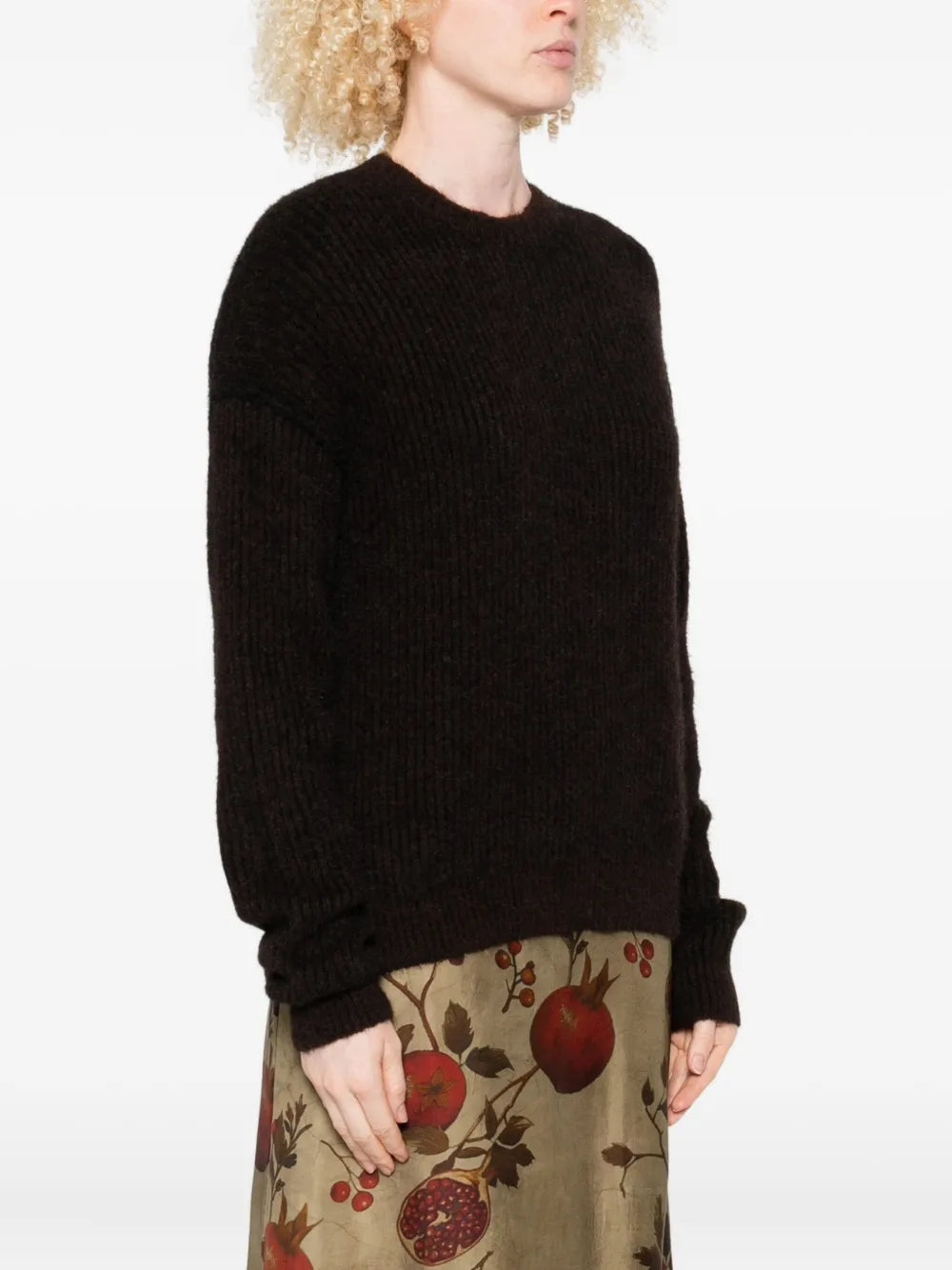 Black top worn by a person, showing the top fit