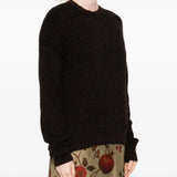 Black top worn by a person, showing the top fit