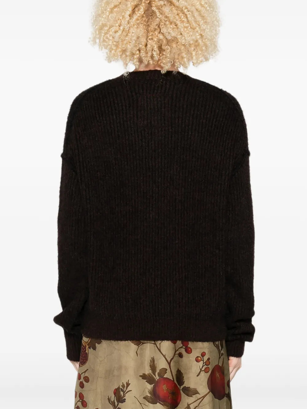 Black top worn by a person, showing the top fit