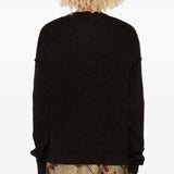 Black top worn by a person, showing the top fit