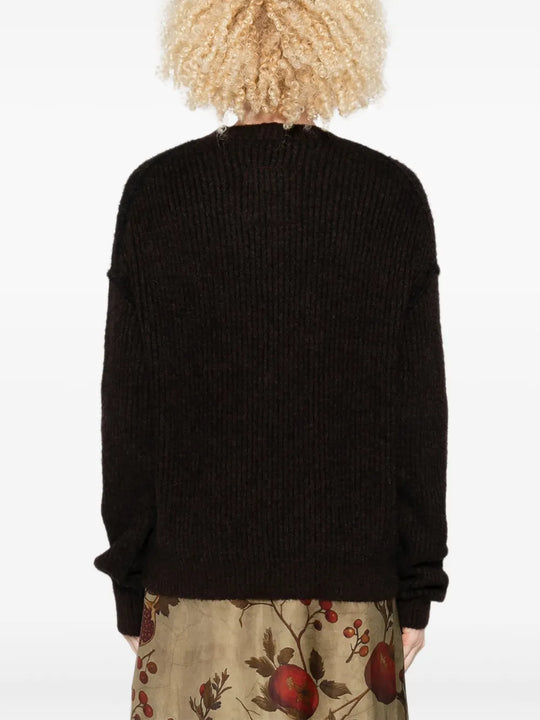 Black top worn by a person, showing the top fit