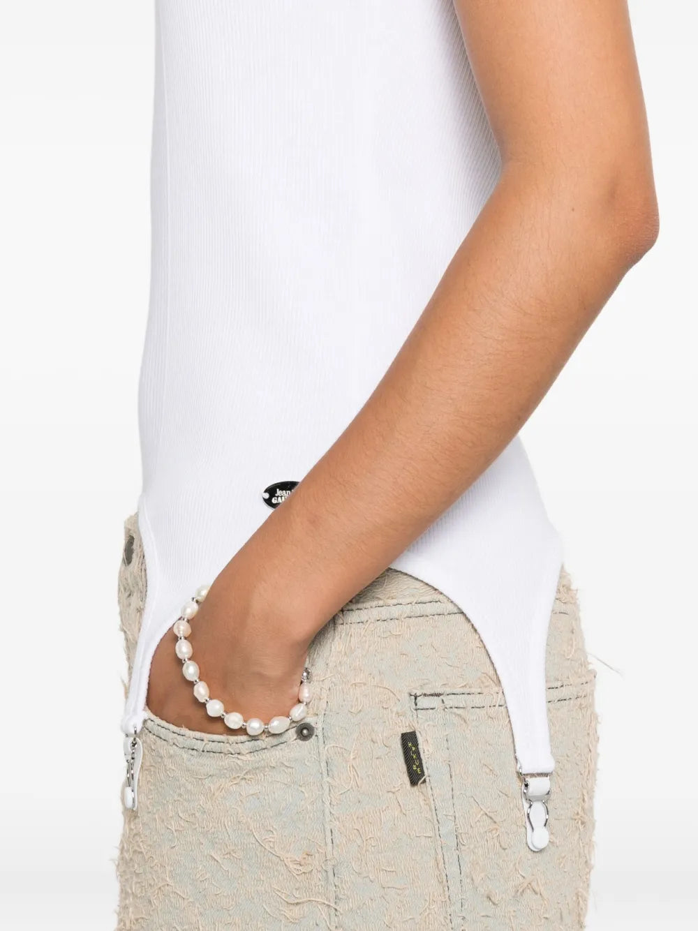 Close up of the white top, showing texture of the cotton fabric