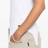 Close up of the white top, showing texture of the cotton fabric