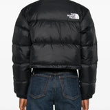 Black jacket worn by a person, showing the jacket's fit