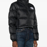 Black jacket worn by a person, showing the jacket's fit