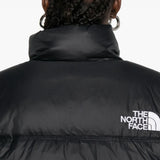 Close up of the black jacket, showing texture of the nylon fabric