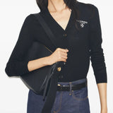 Black bag worn by a person, showing the bag's fit