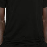 Close up of the black t-shirt, showing texture of the cotton fabric