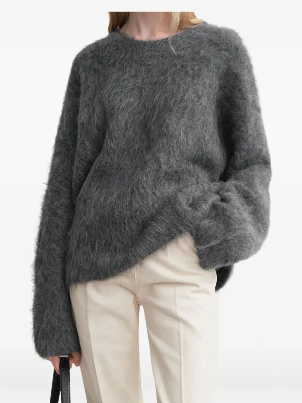 Gray striped top worn by a person, showing the top's fit