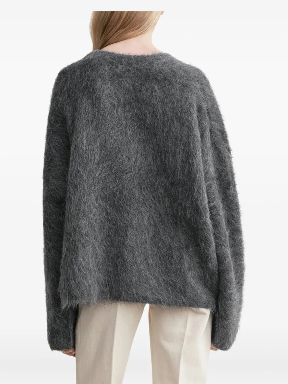 Gray striped top worn by a person, showing the top's fit