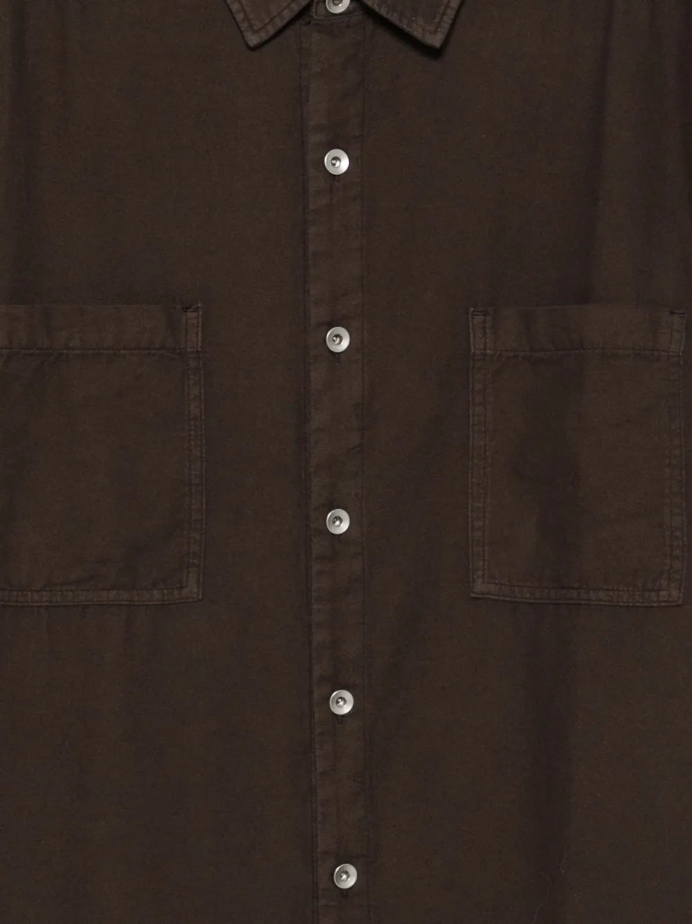 Close up of brown shirts, showing texture of the cotton fabric
