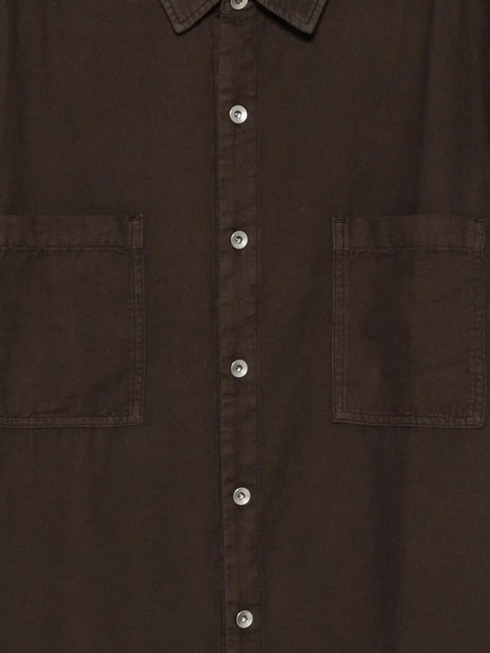 Close up of brown shirts, showing texture of the cotton fabric