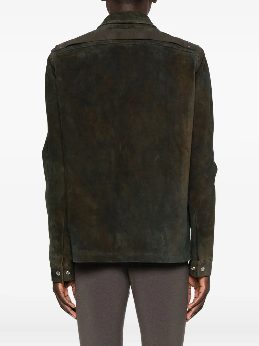 Green jacket worn by a person, showing the jacket's fit