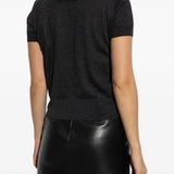 Black sweater worn by a person, showing the sweater's fit