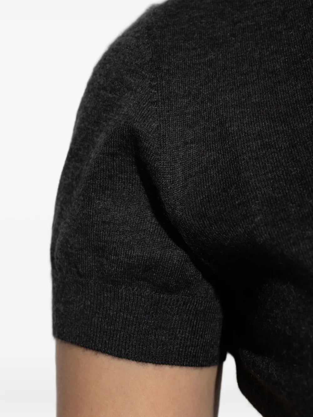 Close up of black sweater, showing texture of the cashmere fabric