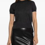 Black sweater worn by a person, showing the sweater's fit