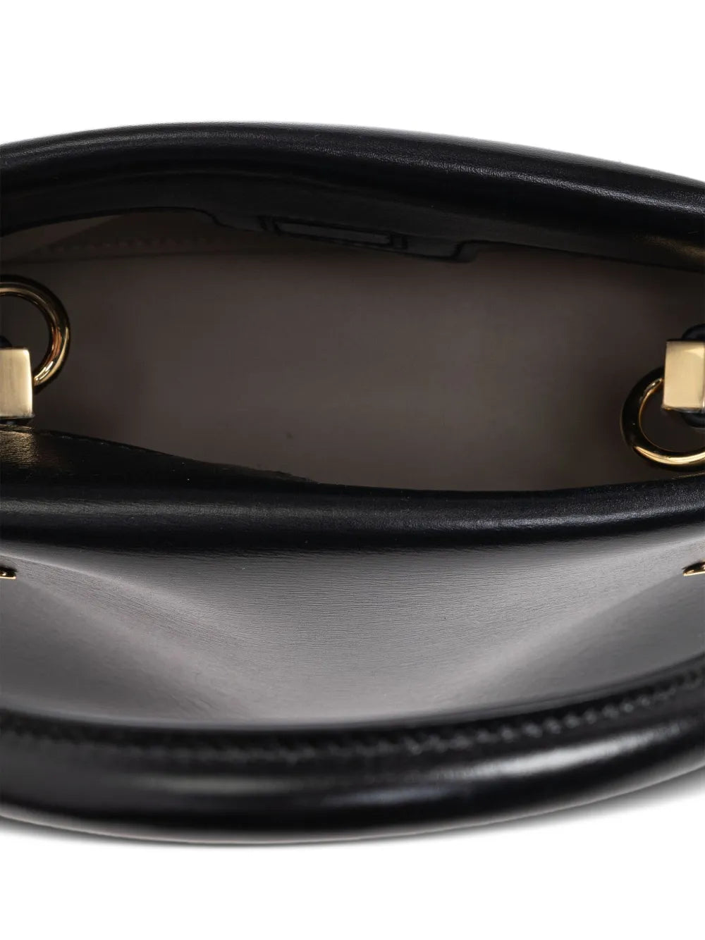 Close up of black bags, showing texture of the calf leather and lamb leather fabric