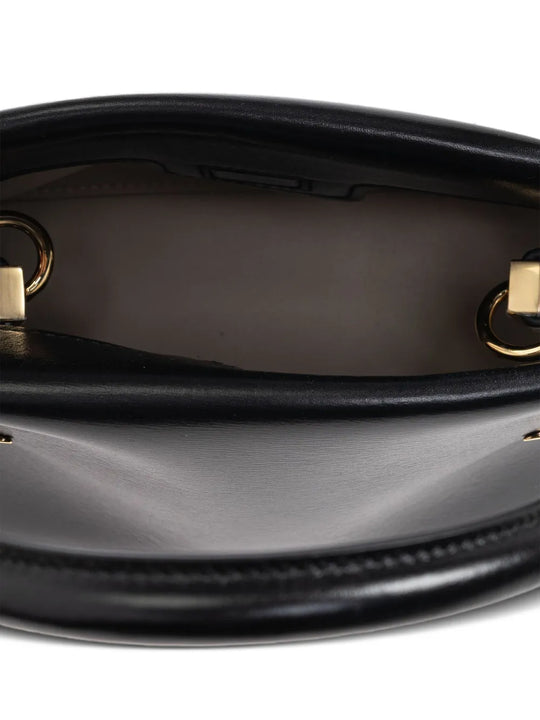 Close up of black bags, showing texture of the calf leather and lamb leather fabric