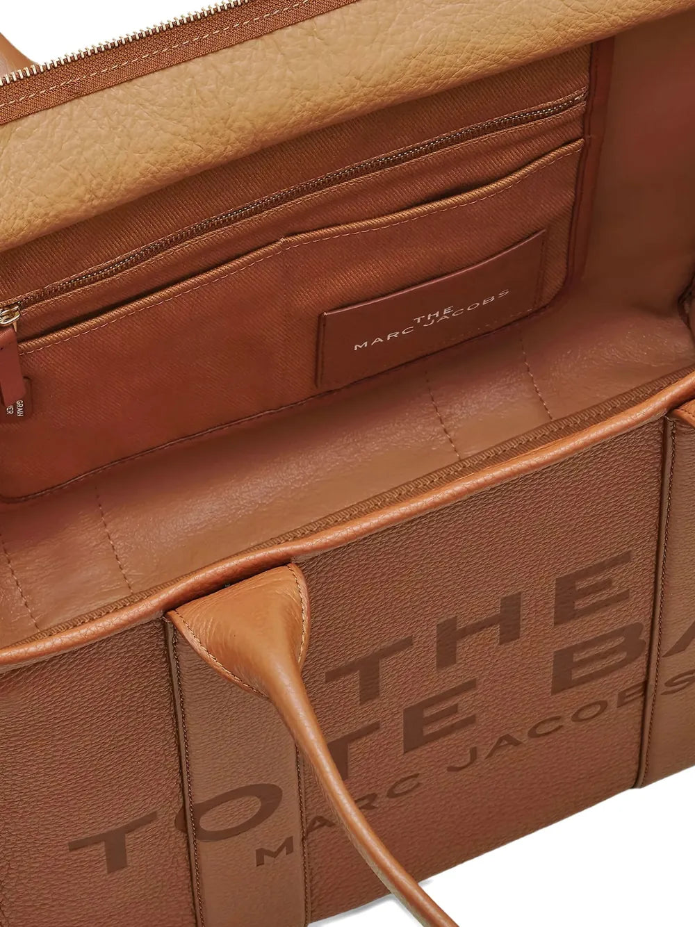 Close up of brown bag, showing texture of the cow leather fabric