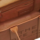 Close up of brown bag, showing texture of the cow leather fabric