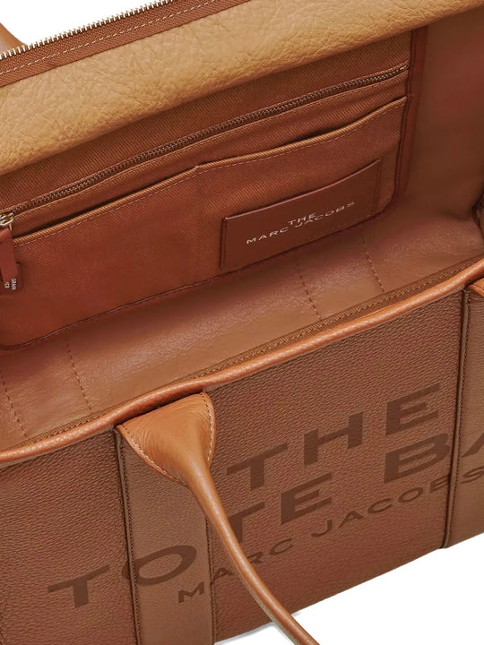 Close up of brown bag, showing texture of the cow leather fabric