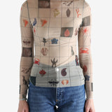 Tan top worn by a person, showing the top's fit